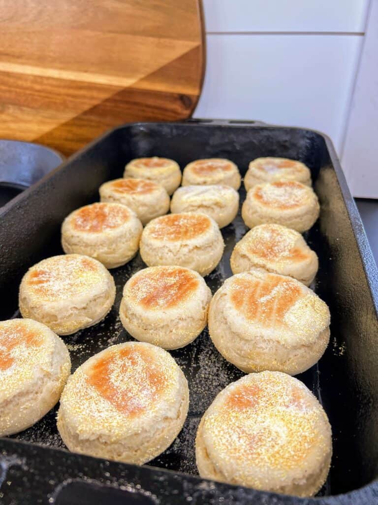 Sourdough English Muffins baking in a skillet