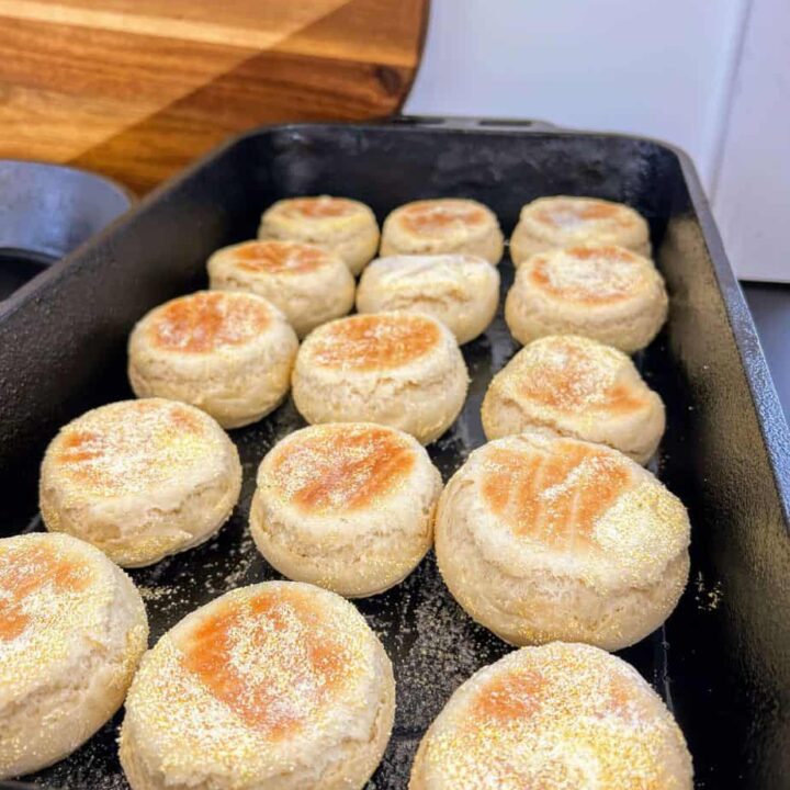 Sourdough English Muffins baking in a skillet