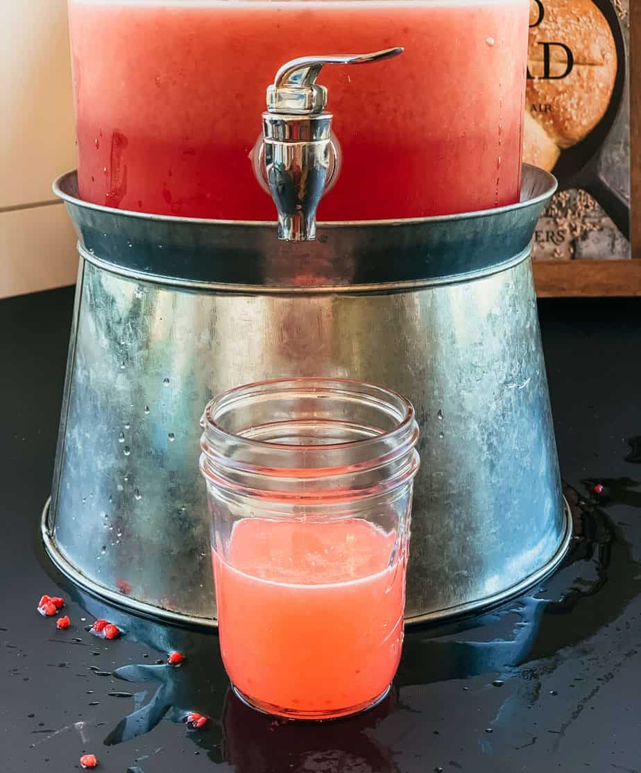 homemade electrolyte drink in a glass farmhouse dispenser