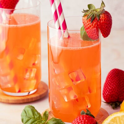 glass cups of strawberry basil lemonade mocktail over ice