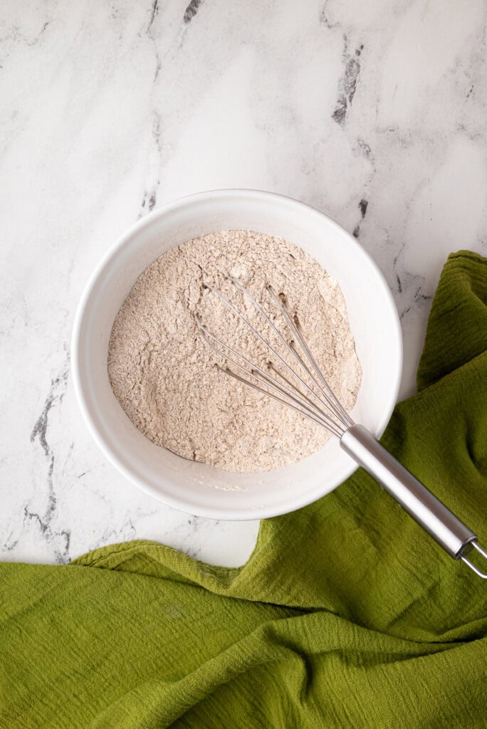 whisking dry ingredients for sourdough zucchini bread