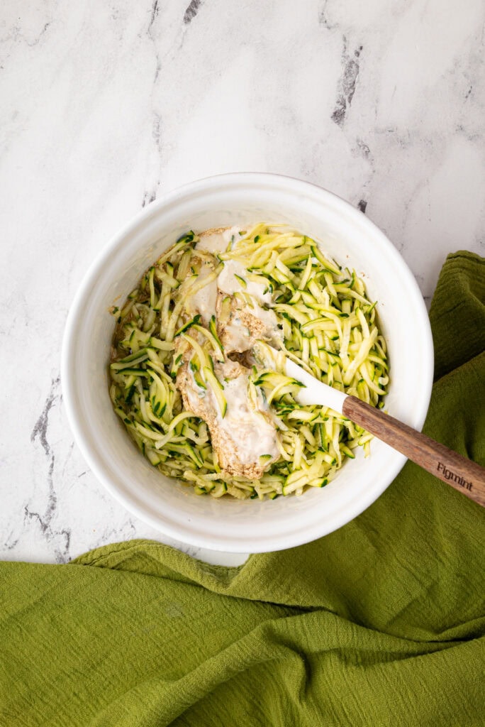 adding zucchini to sourdough zucchini bread