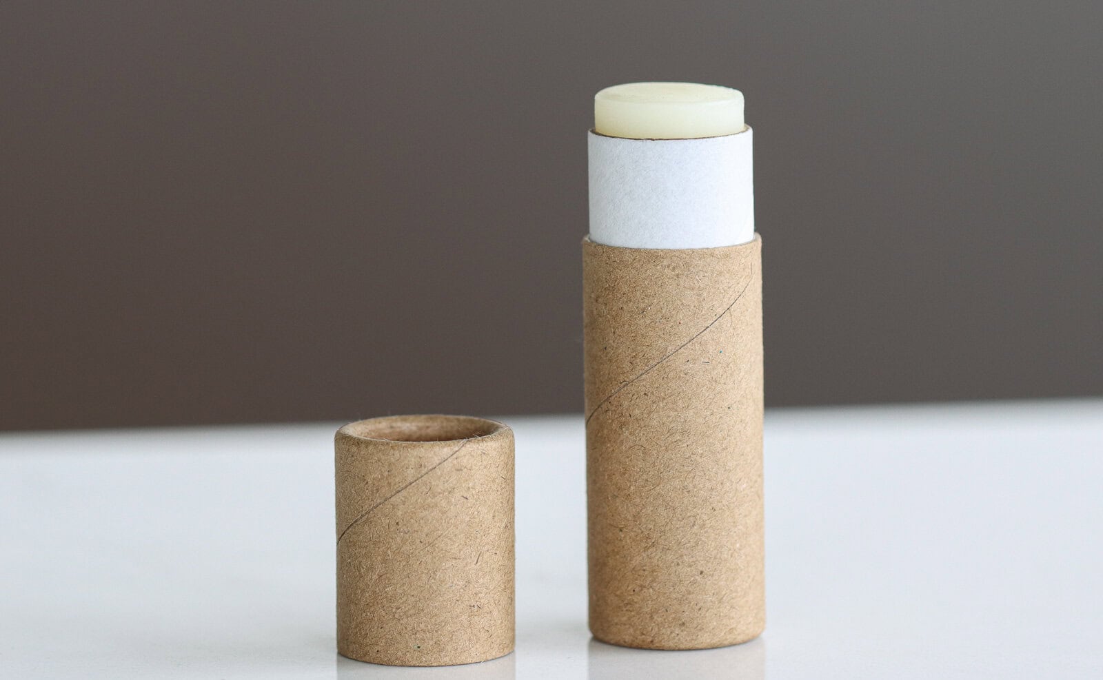 homemade tallow lip balm in a paper tube