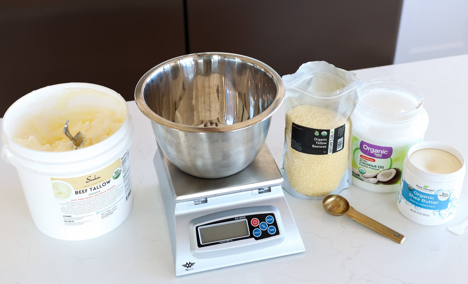 measuring ingredients for homemade tallow lip balm