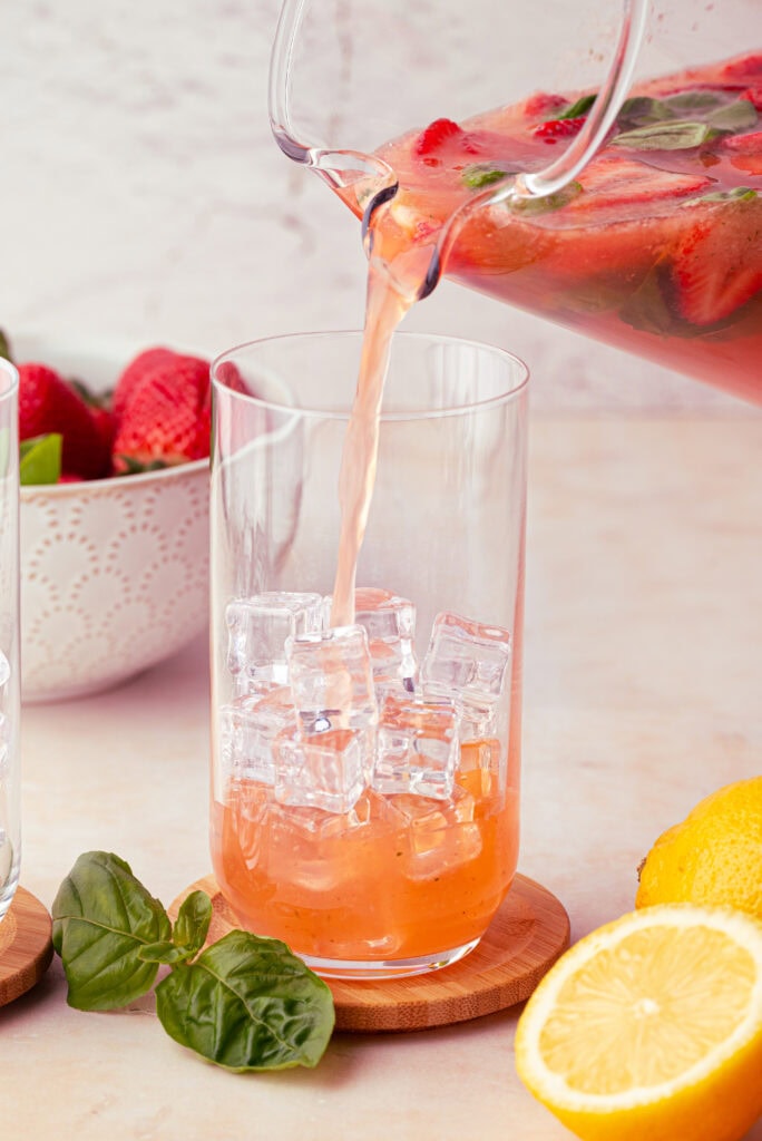 serving strawberry basil lemonade over ice