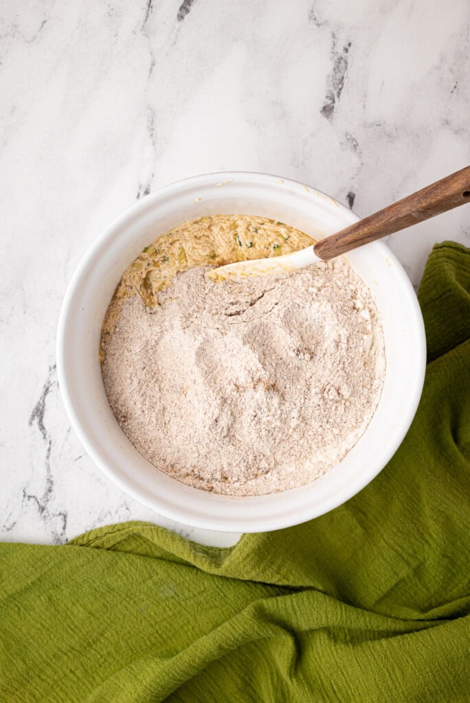 mixing dry ingredients with wet for sourdough zucchini bread